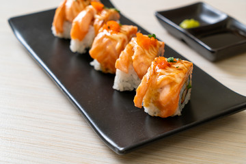 grilled salmon sushi roll with sauce