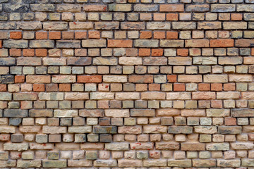 Old stone wall from red brick. Brown color background or wallpaper.