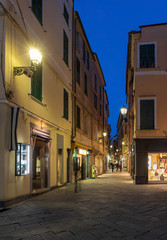 Night view of Alassio narrow street, Italian Riviera