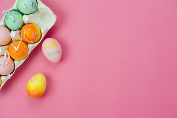 Fototapeta na wymiar Top view shot of arrangement decoration Happy Easter holiday background concept.Flat lay colorful bunny eggs with accessory ornament on modern beautiful pink paper at office desk.Design pastel tone.