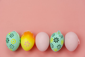 Top view shot of arrangement decoration Happy Easter holiday background concept.Flat lay colorful Easter egg with flower and rabbit doll on modern rustic white wooden at office desk.space for mock up