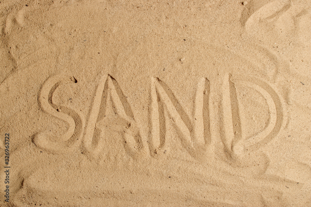 Wall mural inscription on the sand letter word