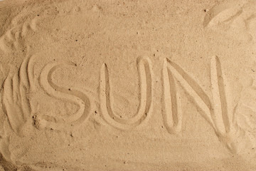 Fototapeta na wymiar The inscription sun sand word