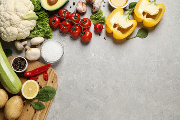 Flat lay composition with fresh products on light grey table,  space for text. Healthy cooking