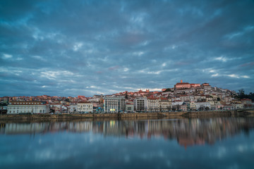 Obraz premium Coimbra with a perfect mirror on the Mondego river