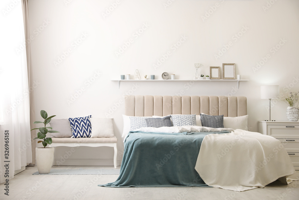 Wall mural comfortable bed with pillows in room. stylish interior design