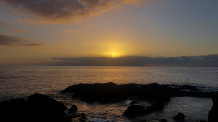 Fototapeta na wymiar Sunset over Gomera from Los Gigantes Tenerife Spain