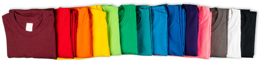 wide panorama banner row of many fresh new fabric cotton t-shirts in colorful rainbow colors...