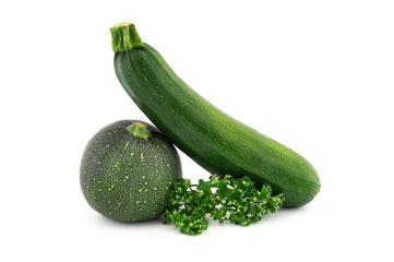 Courgette or zucchini and fresh parsley sprigs