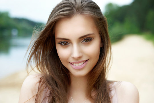 Beautiful cute smiling woman outdoor portrait