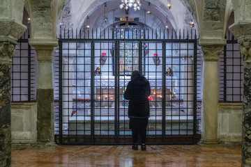 Woman praying in a church