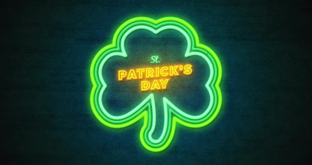 Neon clover with text Saint Patrick's Day. Animation of glowing frame in shape shamrock. Luminescent signboard with clover and congratulation on grunge wall. Night banner with trefoil. 4k video