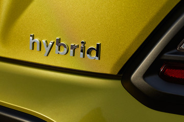 Chromed hybrid car logo on green background - obrazy, fototapety, plakaty