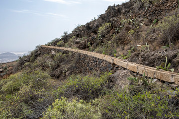 Fototapeta na wymiar Irrigation on hillside near Arona Tenerife, Spain