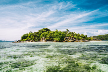 Fototapeta premium Small island in shallow island at Port Glaud lagoon, Mahe island, Seychelles