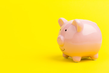 Pink piggy bank on color background. Money saving