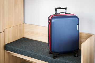 tourist's suitcase is in the hotel room at check-in or check-out