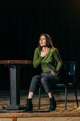 emotional actress performing role on stage in theatre