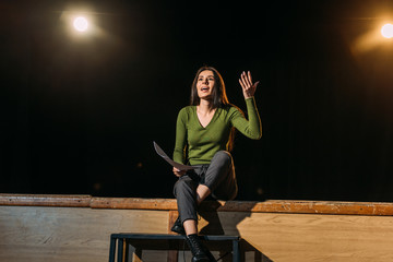 emotional beautiful actress performing role on stage in theatre