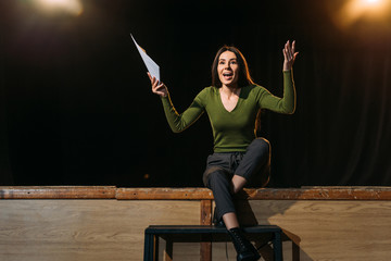 emotional actress performing role on stage in theatre