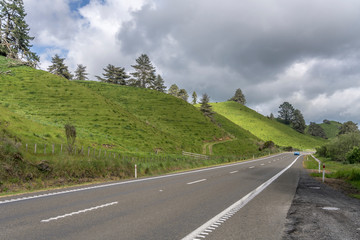 highway 5 in green hilly countryside , near Whakarewarewa, Bay of Plenty, New Zealand