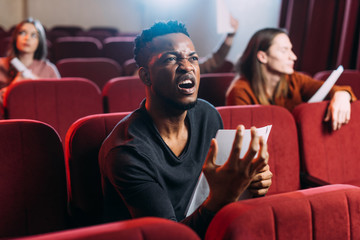 emotional african american actor playing anger in theatre