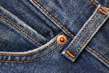 Jeans detail close up, blue denim fabric. Casual jeans front pocket with seams, stitches and metal rivet. Dark blue vintage denim jeans, casual pants element 