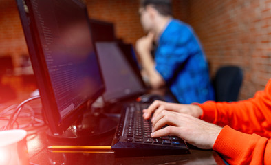 Image of man's hands typing. Selective focus