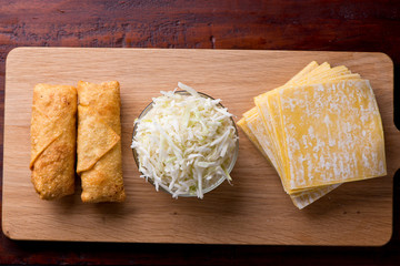 Eggrolls or Springrolls. Traditional Chinese, Thai or Japanese restaurant appetizer, fried. Made from wonton wrappers & filled with Chinese veggies and served w/ a chili dipping sauce or soy sauce.  