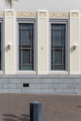Obraz na płótnie Canvas decorated picturesque 30's Deco building tall windows and half-pilasters, Napier, New Zealand
