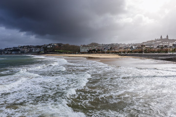 Shore of La Concha Bay in San Sebastian city in Spain, view with Ondarreta beach