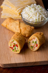 Eggrolls or Springrolls. Traditional Chinese, Thai or Japanese restaurant appetizer, fried. Made from wonton wrappers & filled with Chinese veggies and served w/ a chili dipping sauce or soy sauce.  