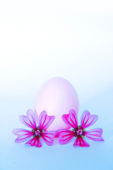 decorative card with the image of pink eggs and pink flowers for Easter