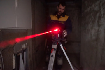 Laser equipment at a construction site - obrazy, fototapety, plakaty