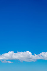 White clouds in the blue sky background