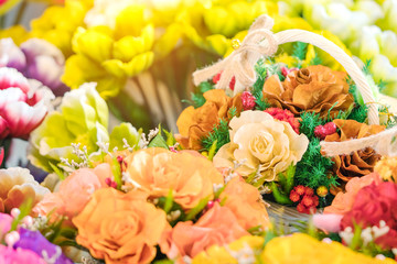 Close up to beautiful decoration artificial flower or faked flowers for sale at local market. Selective focus