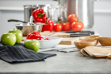 Desk of free space in kitchen interior and woman hands.Sunny day and light of sun from window. 