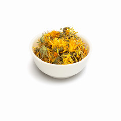 Dried calendula in bowl isolated on white background