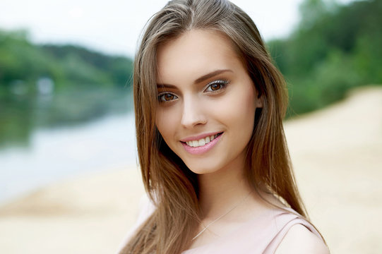 Beautiful cute smiling woman outdoor portrait