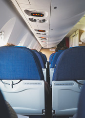 Interior inside of the plane with passengers.