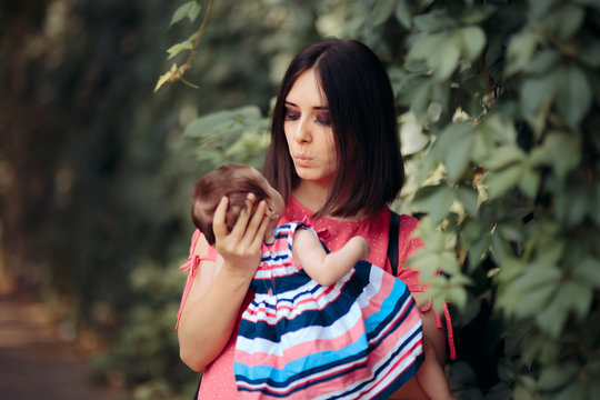 Portrait of Loving Mother and Newborn Baby Daughter 