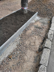 Repair of ramps and sidewalks in the city street.