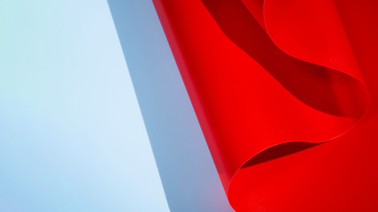 Red abstract curved monochrome paper