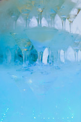 Champagne glasses standing in a tower at the party