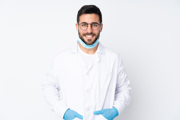 Caucasian dentist man over isolated background