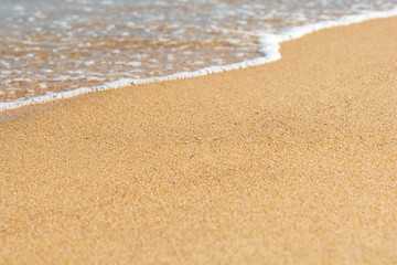 Blue sea wave on sandy beach. Travel background. Soft focus