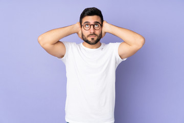 Caucasian handsome man over isolated background frustrated and covering ears