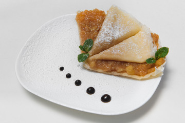 Two Pancakes with apple on white background
