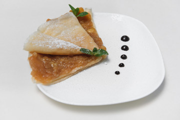 Two Pancakes with apple on white background