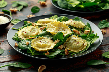 Italian ravioli pasta stuffed with spinach, creamy ricotta cheese, walnuts. Healthy Vegetarian food